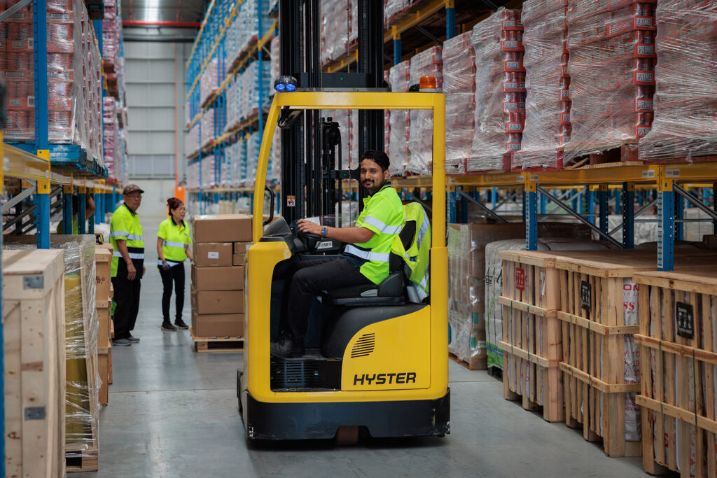 235 BRIFeb2024 4753 BRi warehouse on forklift and team taking stock during peak-season