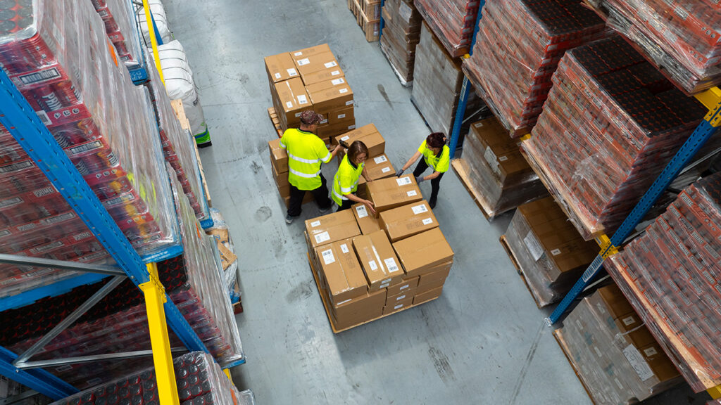 270 BRIFeb2024 0920 BRi warehouse team coordinating a set of boxes on a pallet